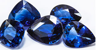 four blue diamonds on a white background