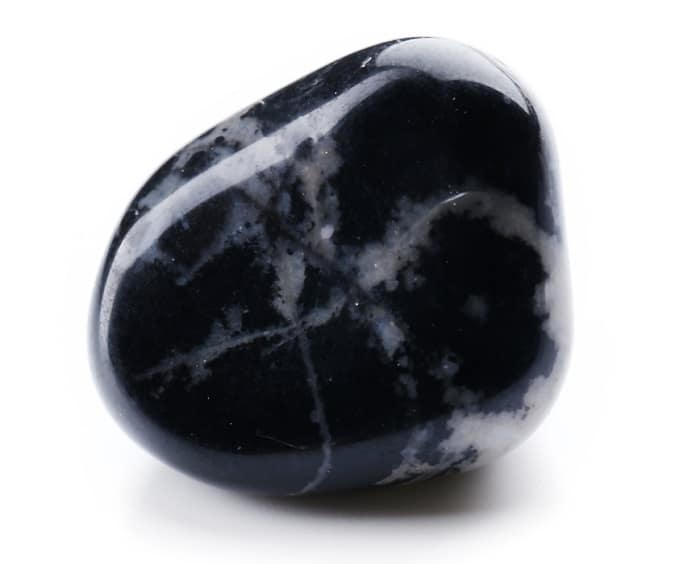 a black and white marble rock on a white background