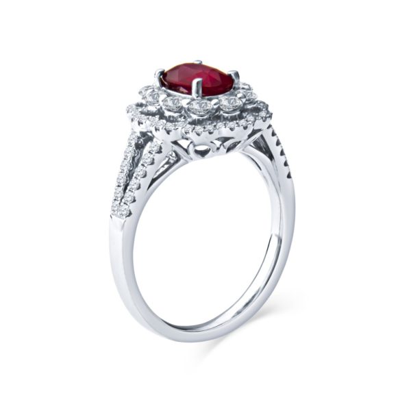 a ring with a red stone in the center