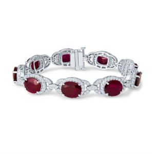 a bracelet with two oval red stones on it