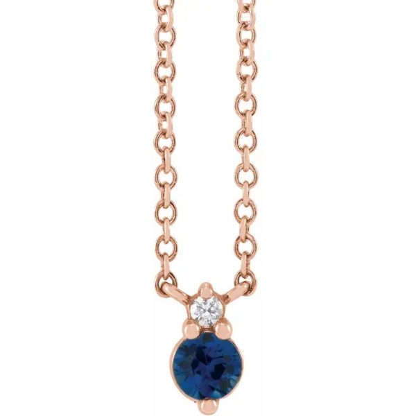 a necklace with a blue stone on it