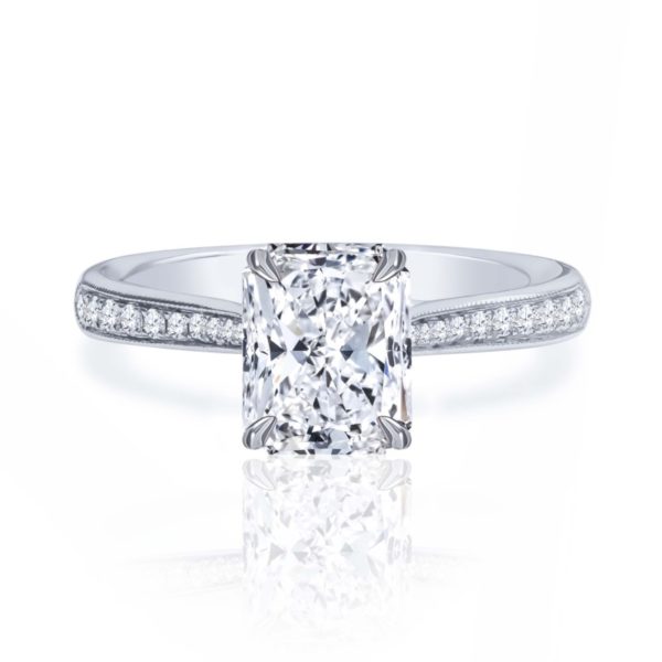 a cushion cut diamond ring with pave set shoulders