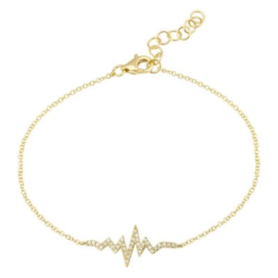 a gold bracelet with a heart and heartbeat on it