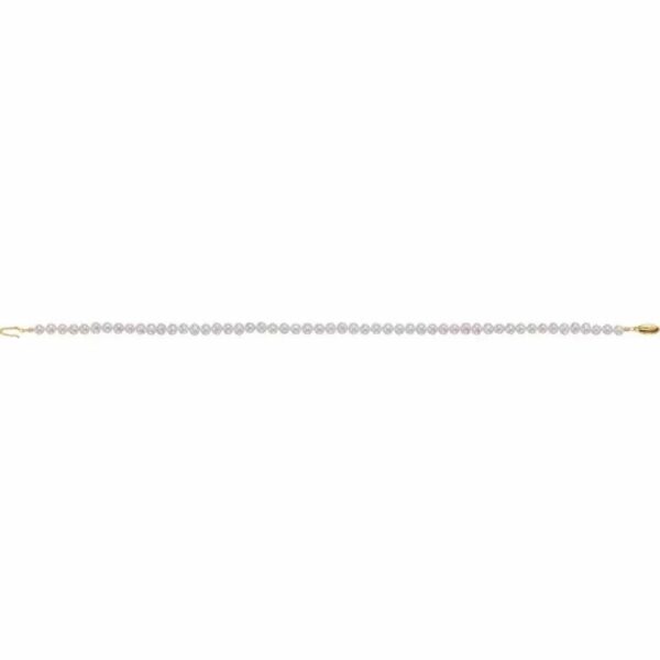a single strand of white pearls on a gold chain