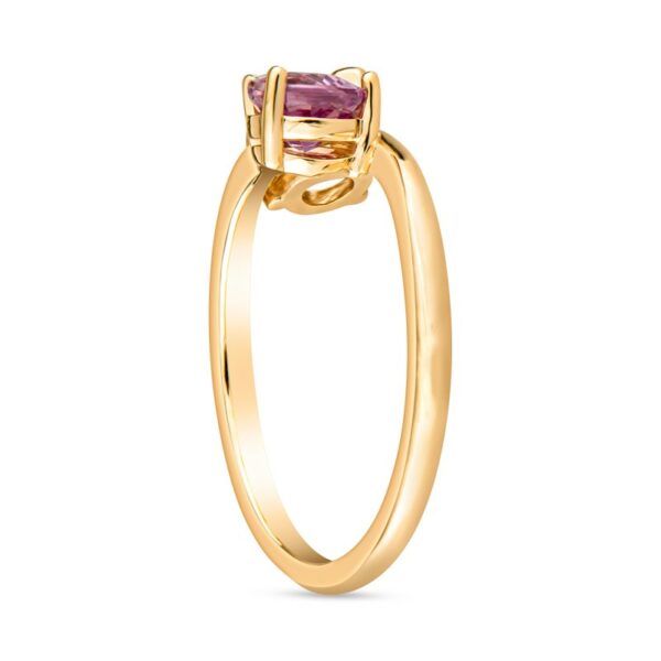 a yellow gold ring with a pink tourmaline stone
