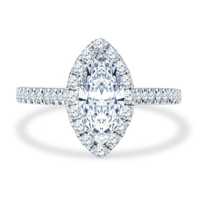 a pear shaped diamond engagement ring on a white background