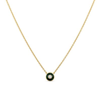 a gold necklace with a green stone in the center