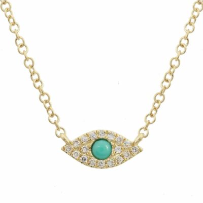 a gold necklace with an evil eye charm