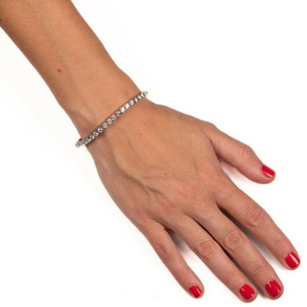 a woman's hand with a bracelet on it