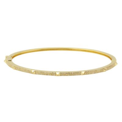a gold bang bracelet with diamonds