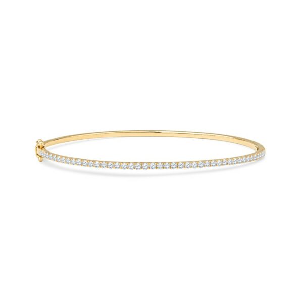 a gold bracelet with white diamonds