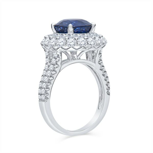 a blue and white diamond ring on a white background