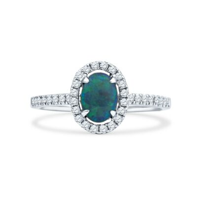 a white gold ring with an oval black opal surrounded by diamonds