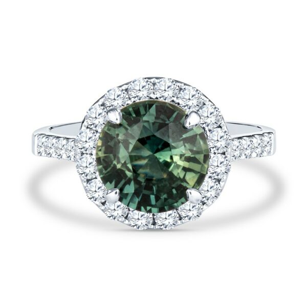 a green diamond ring with diamonds around it