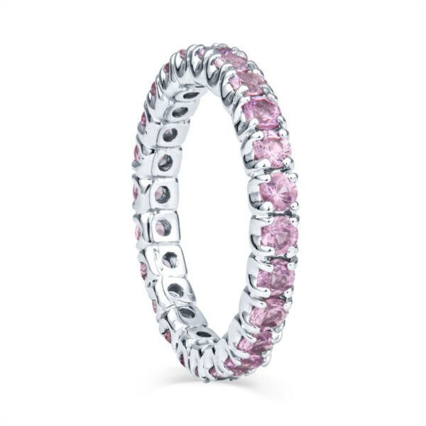 a pink diamond ring on a white background