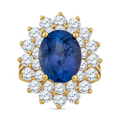 an oval blue sapphire surrounded by white and yellow diamonds
