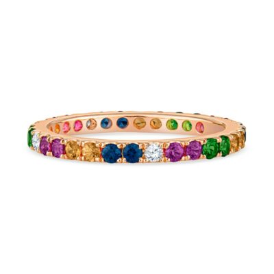a gold ring with multicolored stones