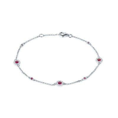a silver bracelet with red stones