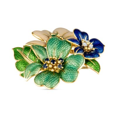 a blue and green flower broochle on a white background