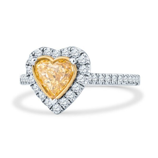 a yellow diamond heart shaped ring on a white background