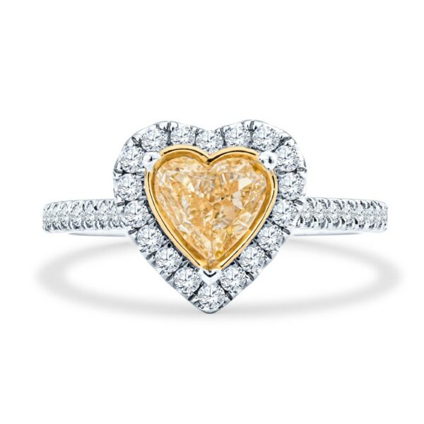 a yellow diamond heart shaped ring with diamonds around it