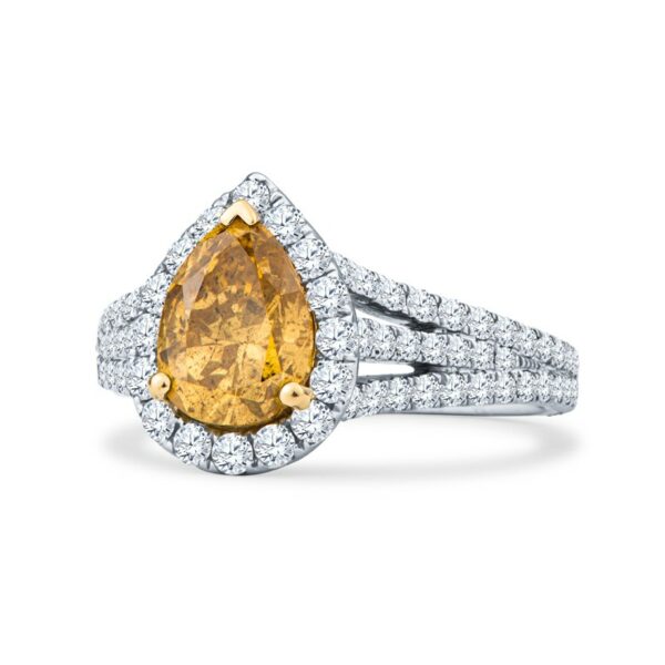a fancy yellow diamond ring set in 18k white gold