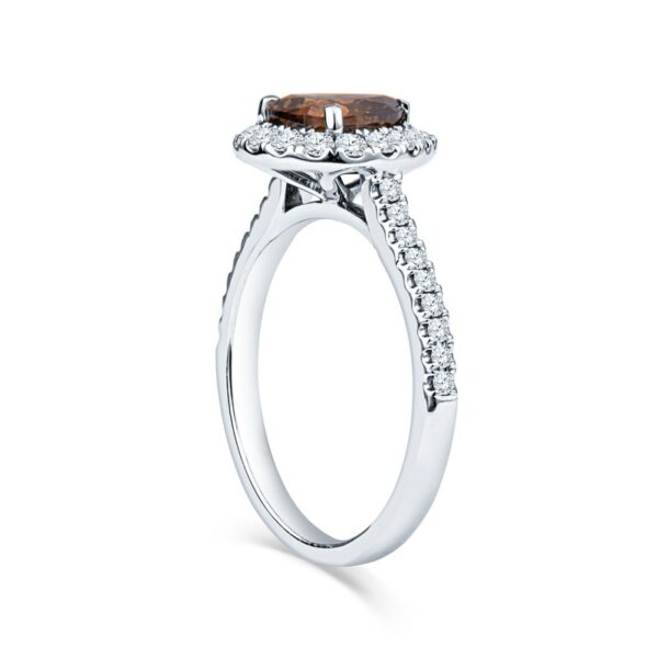 a ring with a brown stone and diamonds