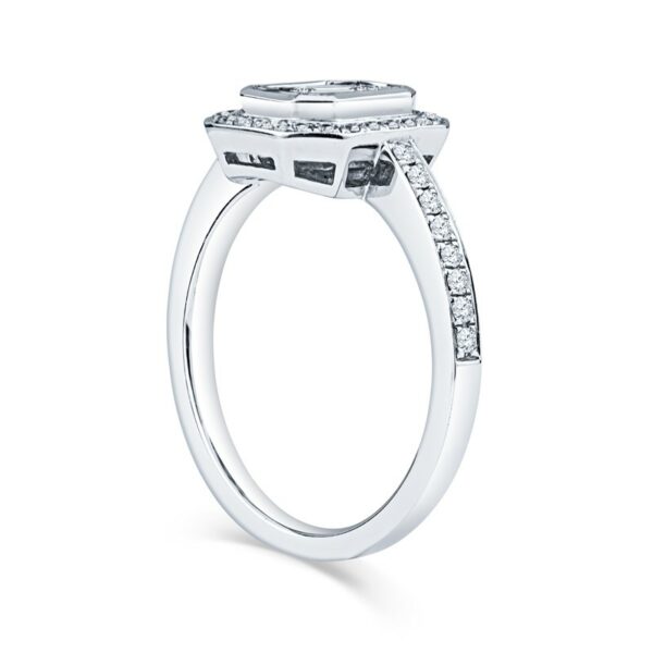 a white gold engagement ring with two diamonds on the side