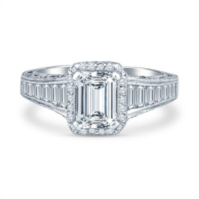 an emerald cut diamond ring with baguetts on the shoulders