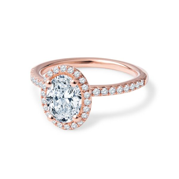 a rose gold engagement ring with an oval cut diamond
