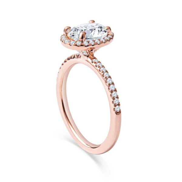 a rose gold engagement ring with an oval cut diamond