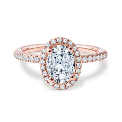 a rose gold engagement ring with an oval diamond center