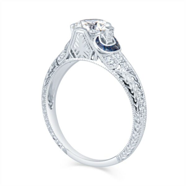 a white gold ring with an intricate design
