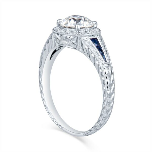 a white gold engagement ring with an oval center stone