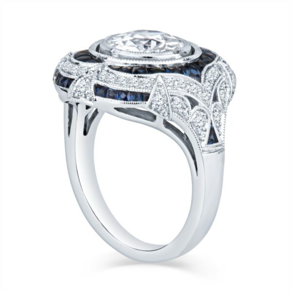 a ring with blue and white diamonds on it