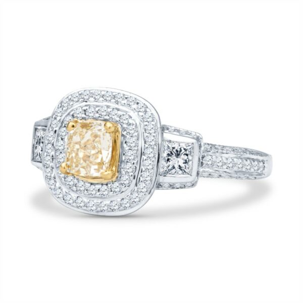 a fancy yellow diamond ring with two diamonds