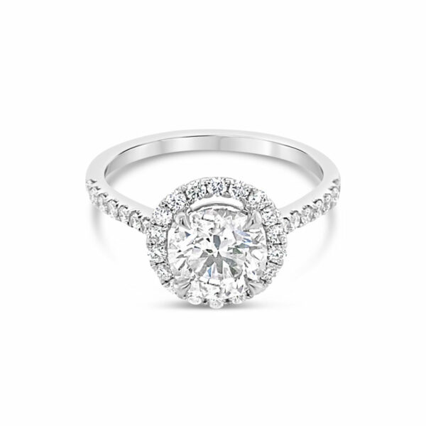 a round cut diamond ring with halos around it