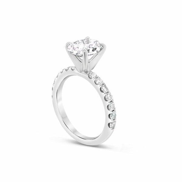 a white gold engagement ring with a single diamond