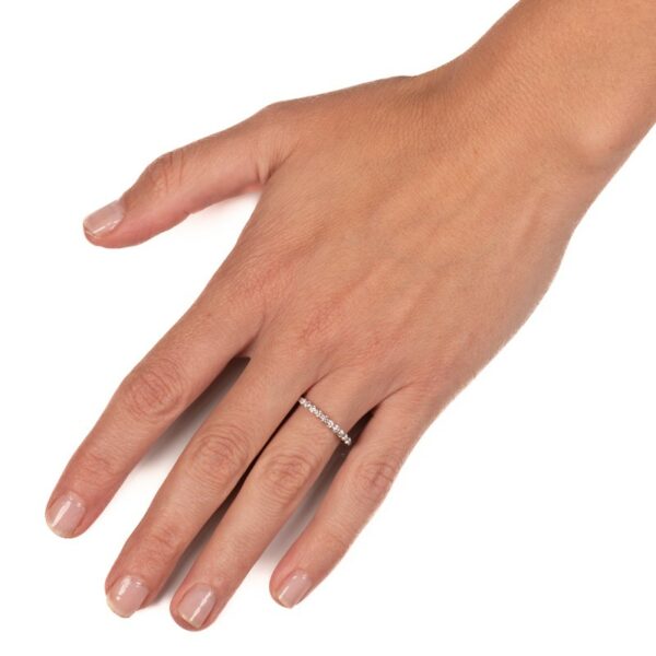 a woman's hand with a diamond ring on it