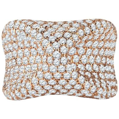 a gold and white pillow with diamonds on it