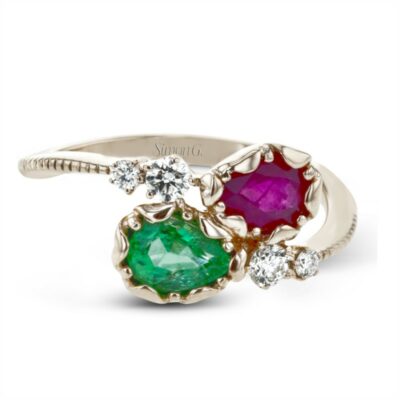 three stone ring with diamonds and emeralds