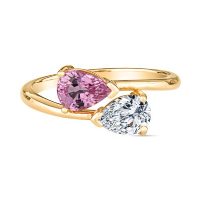 two pear shaped diamonds in yellow gold and pink sapphire