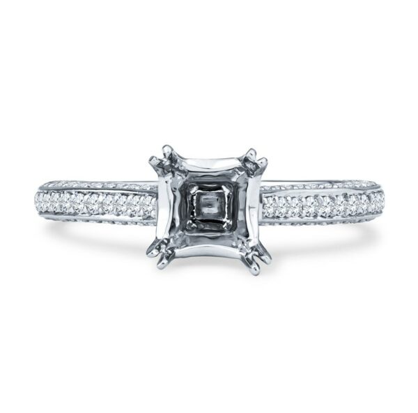 a white gold ring with a square cut diamond in the center