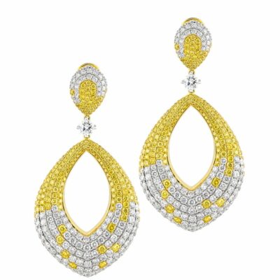 a pair of earrings with yellow and white diamonds