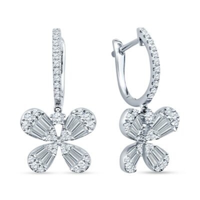 a pair of diamond earrings with a flower design