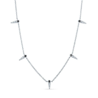 a silver necklace with three diamonds on it