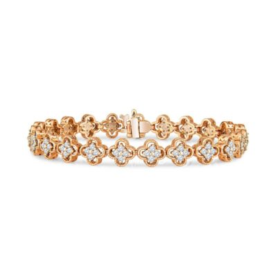 a gold bracelet with white diamonds