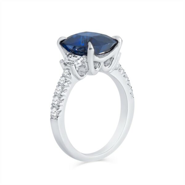 a ring with a blue sapphire and diamonds