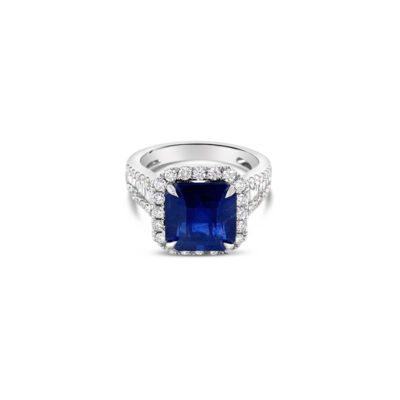 a blue sapphire and diamond ring on a white background