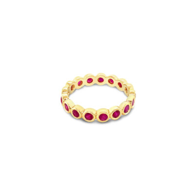 a yellow gold ring with red stones